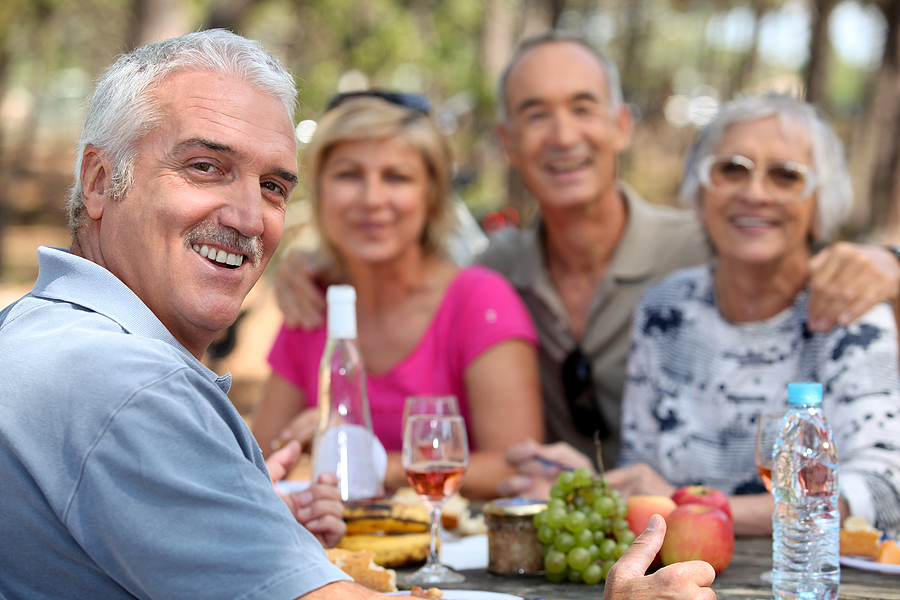 Older adults enjoying lunch outdoors in Skillman, NJ