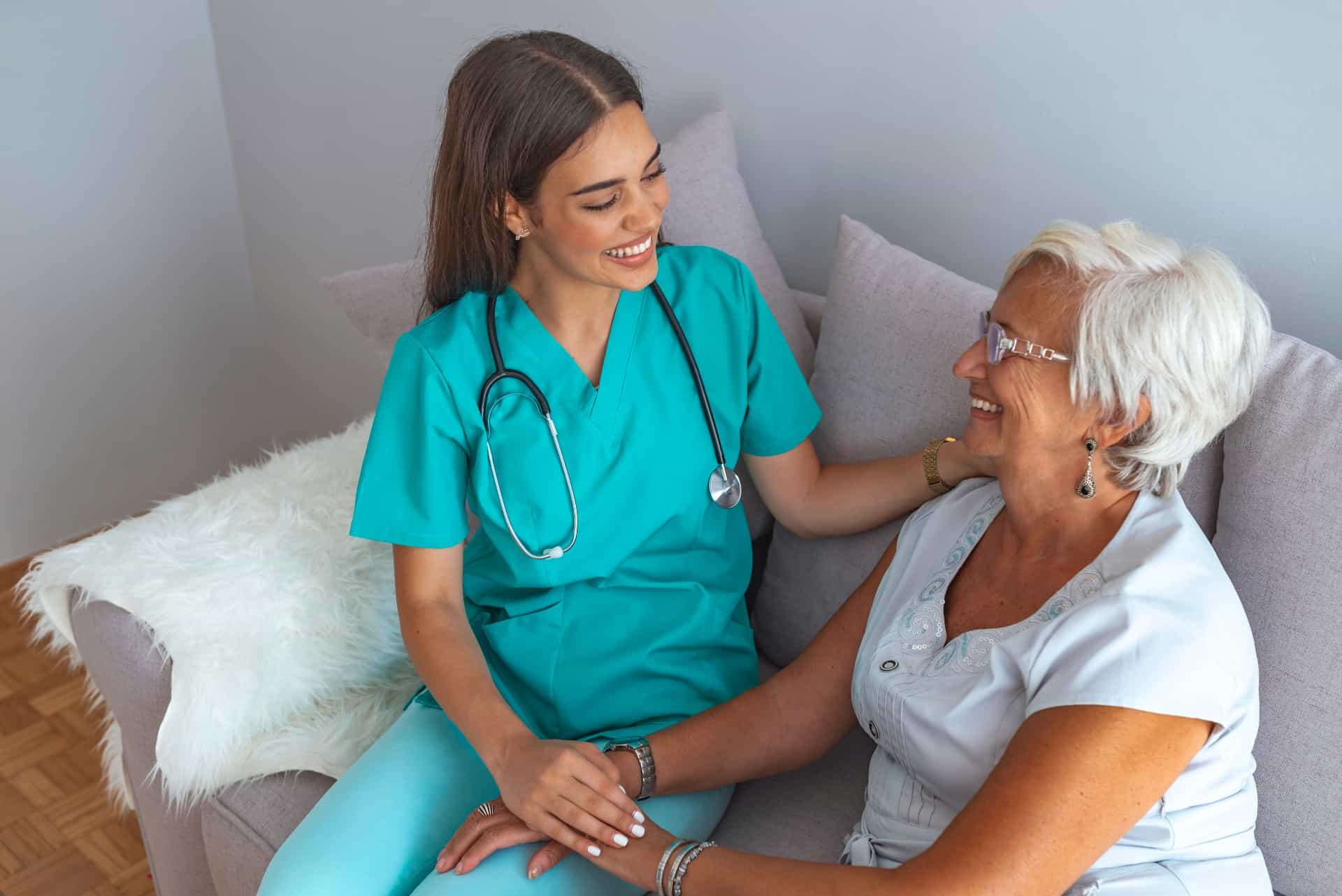 Nurse helping a young senior woman.
