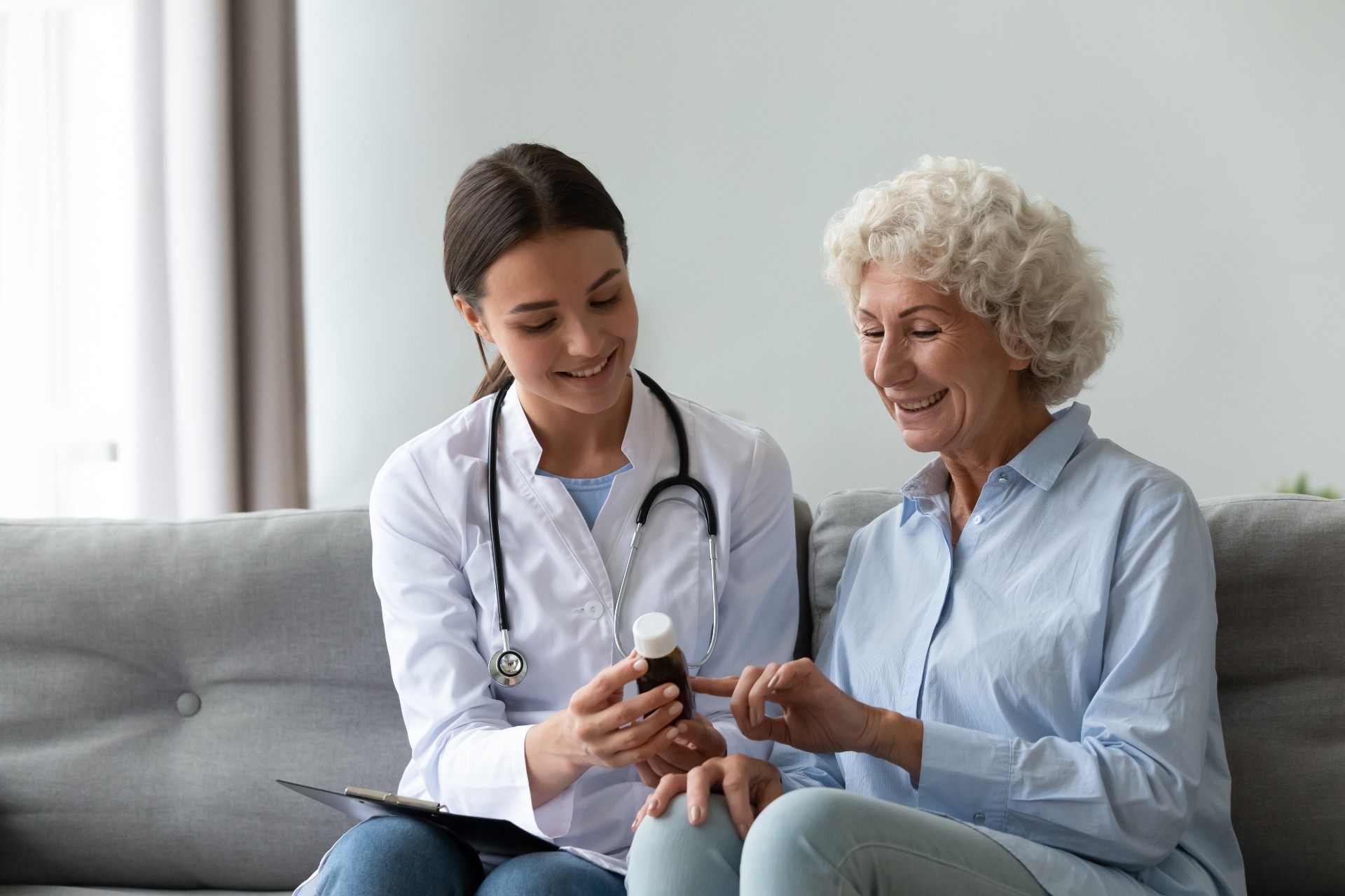 Happy senior woman talking to her doctor