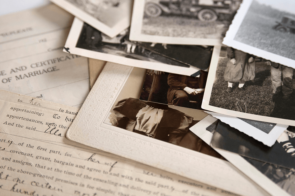 printed photographs laying on table