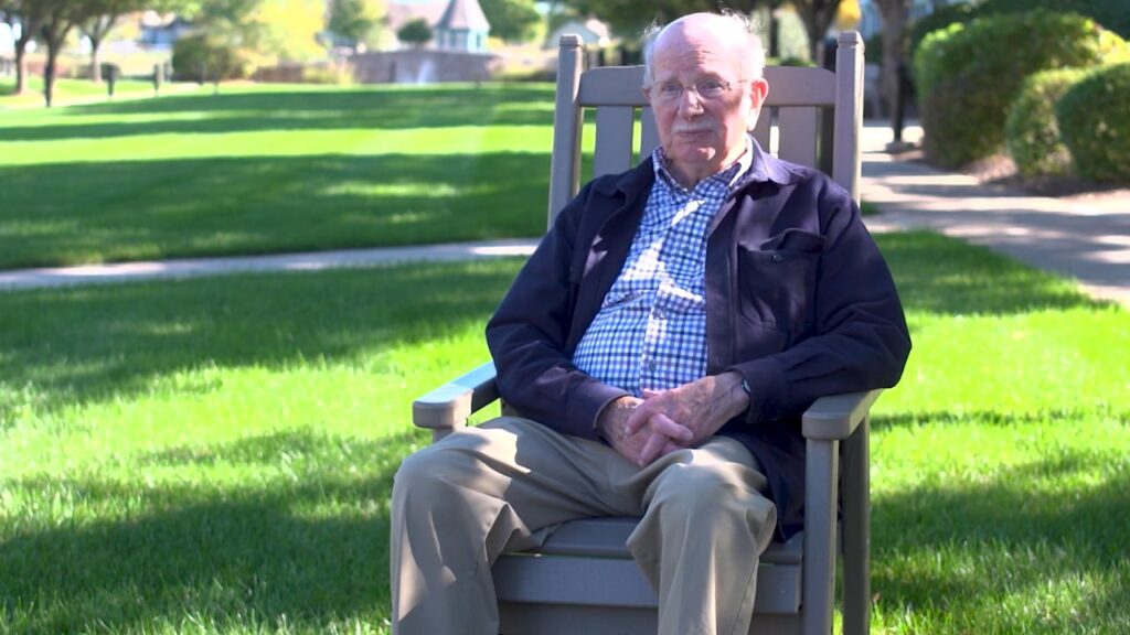 old man sitting on chair
