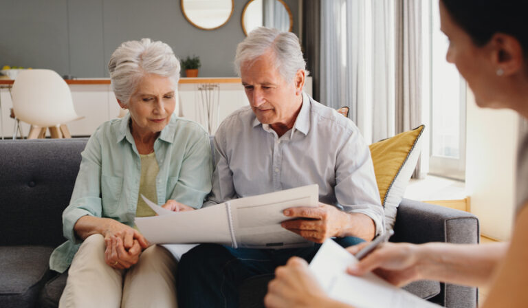 senior couple reviewing paperwork