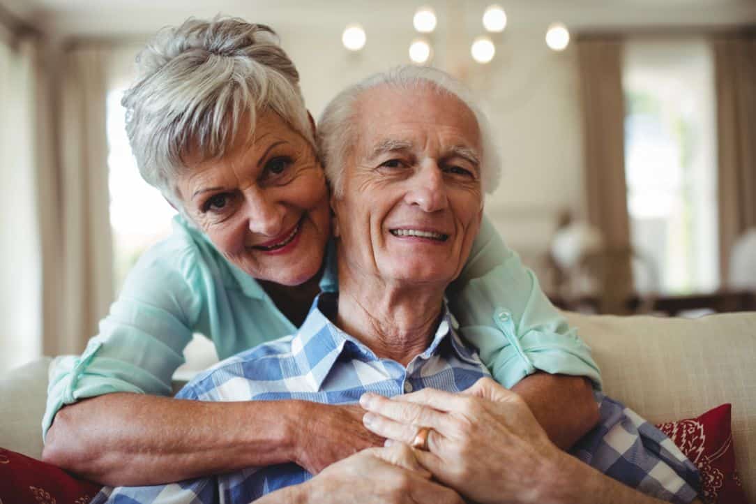 Senior couple enjoying their apartment and the benefits of senior living.