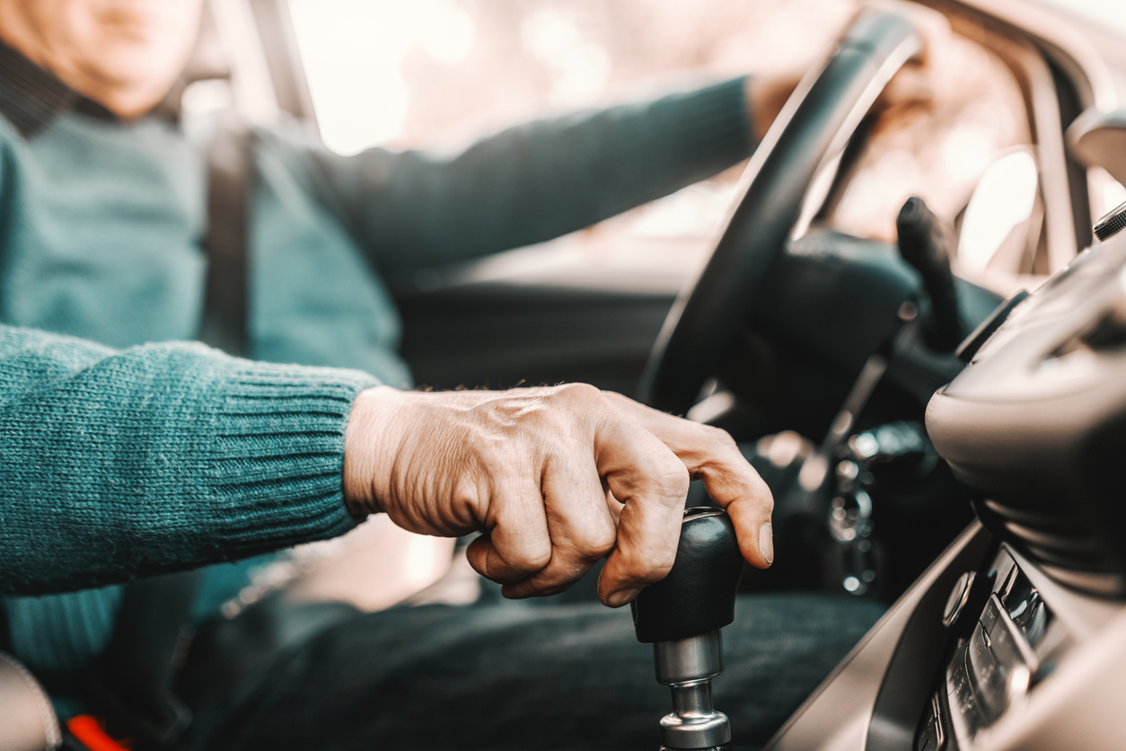 Older adult driving a car
